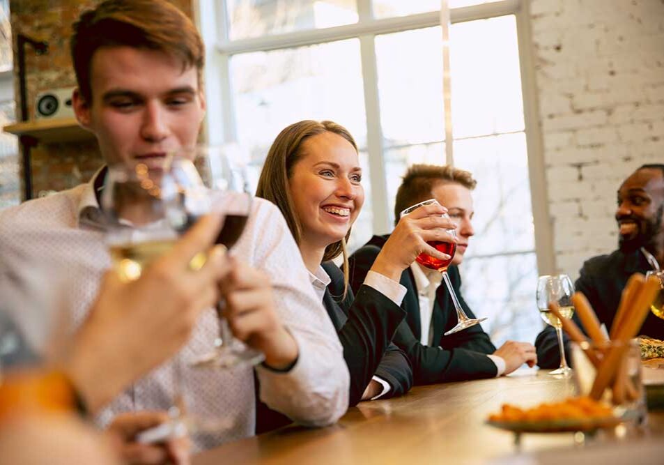 happy-co-workers-celebrating-while-compaorate-event